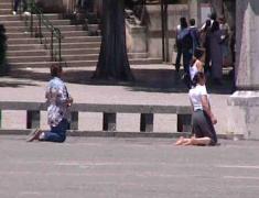 Pilgrims kneeling in Fatima square